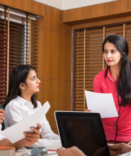 Asian Indian Business People or Corporate culture and Working in the office Concept with Laptop, papers, meetings, presentations and discussions